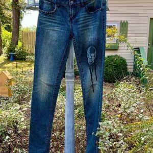 Idle Minds (Topshop) jeans, medium dark wash with skull printed on front thigh